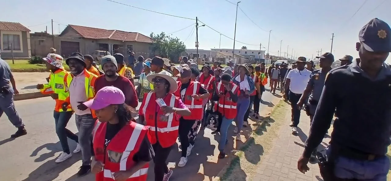 Security staff managing a large crowd at a public event